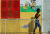 São Filipe, Fogo island - Cape Verde / Cabo Verde: woman walking - railing and mural - photo by E.Petitalot